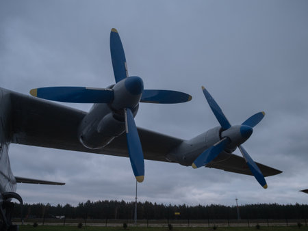 blue propellers symmetry, aircraft propellers with contrasting blue tips under cloudy skies creating visualの写真素材