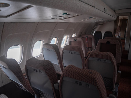 calm flight atmosphere, elegant airplane cabin ambiance featuring textured upholstery and peaceful reflectionsの写真素材