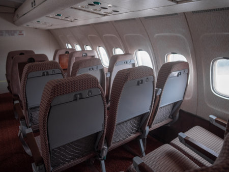 aircraft seatback showing tray and storage space, closeup of airplane seatback highlighting features