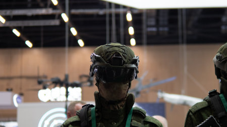 Military Personnel Equipped With Modern Firearms at an International Defense Exhibition, Showcasing...