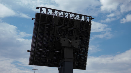 Military Radar System Deployed in Conflict Zone Under Cloudy Skiesの写真素材