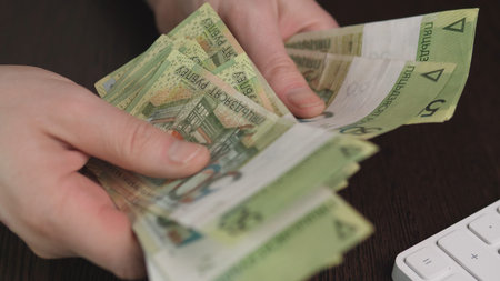 Hands Laying Out Polish Banknotes On Dark Table, Decisive Disbursement Gesture For Loan Or Capital,...