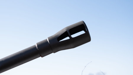 Closeup Of Gun Muzzle. Industrial Firearm Component With Textured Surface. Focused Image Showing...