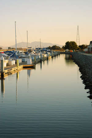 Sunset at a California marina with reflectionsの写真素材