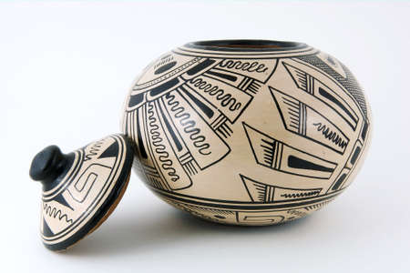 Honduran clay pot with black pattern and lid removed isolated on a white backgroundの写真素材