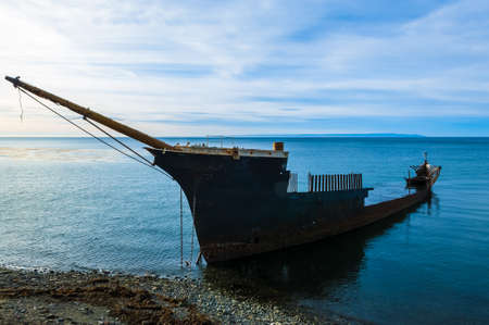 Shipwreck south of Punta Arenas, Chile, depicting a lonely, decrepit state forgotten at the end of...