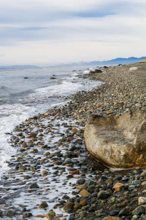 Coastline along the souther tip of Chile with the straits of Magellen in the backgroundの写真素材