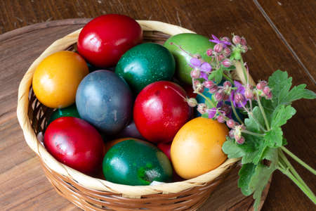 Easter eggs with flowers - wood background
