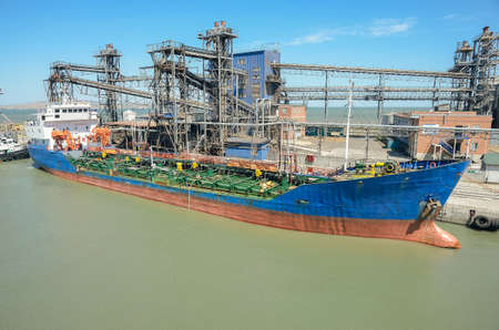 Loading on berth at the seaport of a large cargo ship