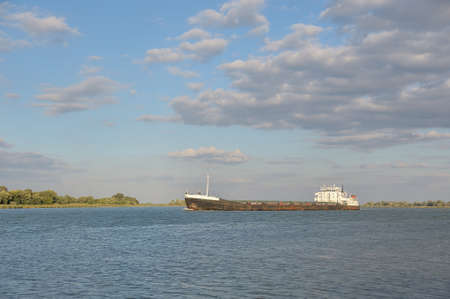 Big Cargo ship floats on the riverの写真素材