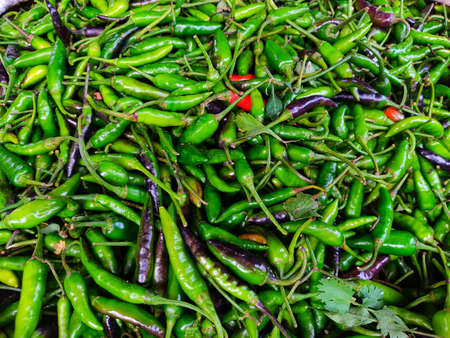 bunch of fresh green chilli close up