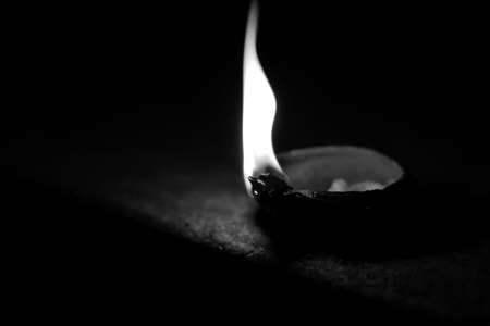 oil lamp diya with flame in dark night indian festival diwali celebrationの写真素材