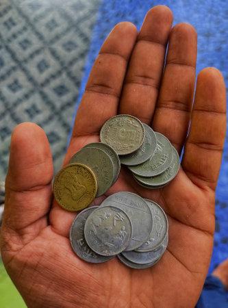 Indian currency coin in hand