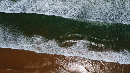 arial drone view of sea beach with ocean waveの写真素材