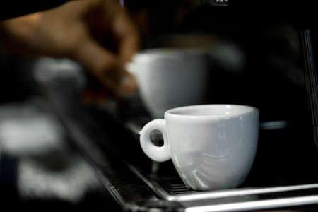 Coffee cup on a coffee machine at a coffee shop. Still details. high quality photoの写真素材