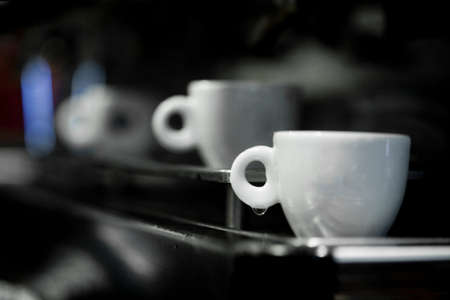 Coffee cup on a coffee machine at a coffee shop. Still details. high quality photoの写真素材