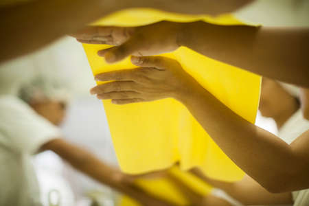 Human Hands making Raw and dry capeletti pasta on kitchen tableの写真素材