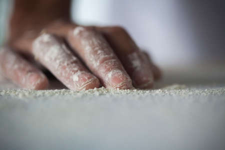 Human Hand making paste - making Raw and dry paste on kitchen table - flowerの写真素材