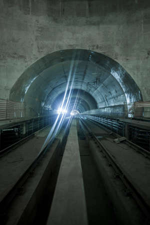 Underground facility with a big tunnel leading deep down. Metro - subway construction site. high quality photoの写真素材