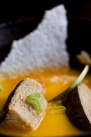 Amazonian cuisine. Green ingredients, manioc soup on a wooden table set. high quality photoの写真素材