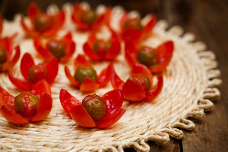 Tomatoes and onions on a kitchen cooking boards. Food background. high quality photoの写真素材