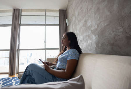 Young white man working at home with laptop on desk. Home office concept. Gray notebook for working. high quality photoの写真素材