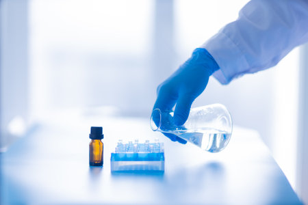 Production line pharmaceutical industry. Manufacturing of drugs and medications, pharmaceuticals. Laboratory gloves blueの写真素材