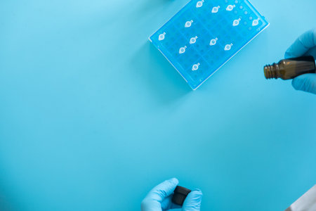 Production line pharmaceutical industry. Manufacturing of drugs and medications, pharmaceuticals. laboratory gloves blueの写真素材