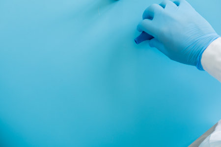 Production line pharmaceutical industry. Manufacturing of drugs and medications, pharmaceuticals. laboratory gloves blueの写真素材