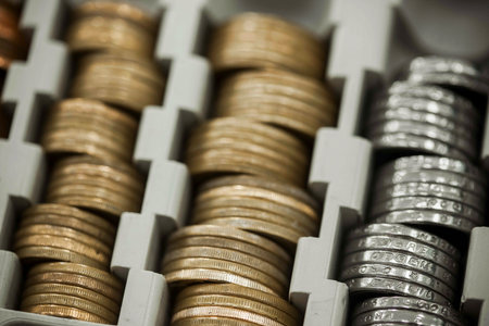 Stack of coins in box close up. Finance and banking concept.の写真素材