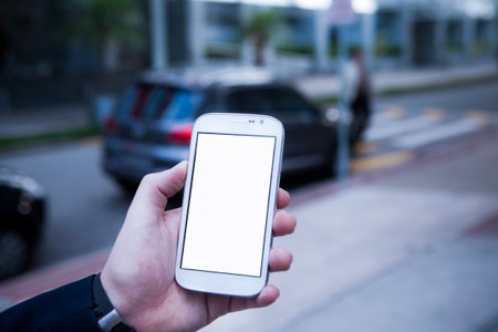 Hand of business people holding smartphone - mobile phone.の写真素材