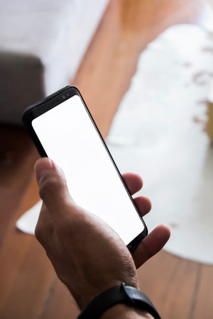 Hand of business people holding smartphone - mobile phone.の写真素材