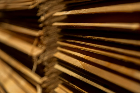 Close-up of stacked plywood boards in storage, showing manufacturing and construction materials