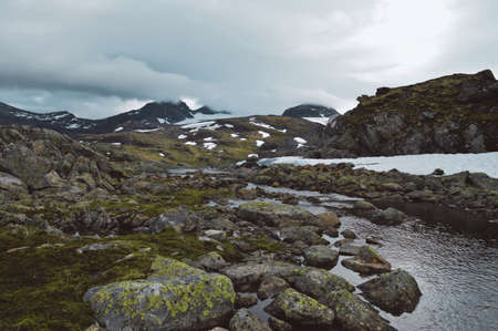Little stream and mountains in Norway Jotunheimen National Parkの写真素材