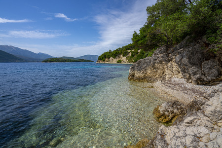 Desimi Beach Golf and nearby Island with clear water in Greeceの写真素材