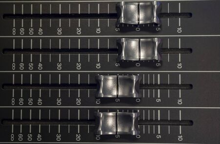 Audio Mixer with Faders pushed up on a Mixerの写真素材