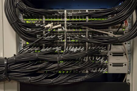 Network Switch and Ethernet Cables Patched into Local Network and IPTVの写真素材