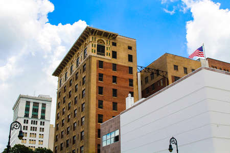 Brick building with a sky background in a downtown square.の写真素材