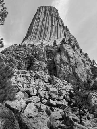 Devils Tower with Rocky Foundation In Bright Day In Northeast Wyoming Grayscaleの写真素材