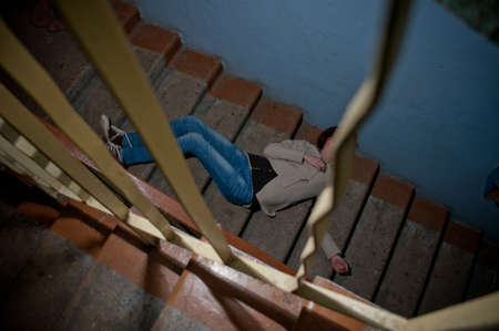 Girl laying in the staircaseの写真素材