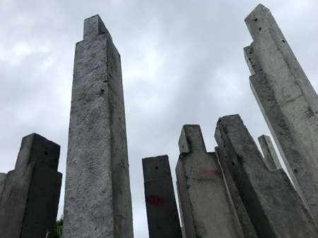 The cement pillars that were arranged vertically were painted in gray tones.の写真素材