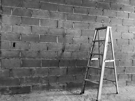 White steel, which is located on the floor and has a cement wall background.の写真素材