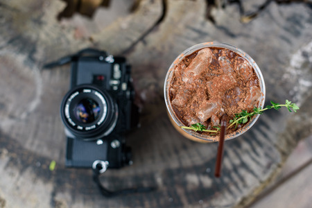 Iced cocoa with film camera top viewの写真素材