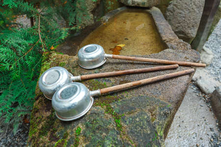 Tradition of hand washing before entering the temple in Japan.の写真素材