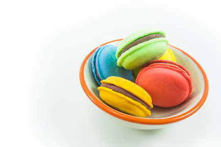 Macaroon dessert in a cup on a white backgroundの写真素材