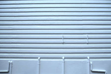 Pattern white plaster walls and water pipes tubeの写真素材