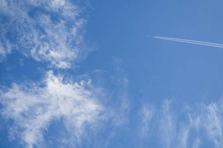 Jets flying in the sky with clouds in the morning sun shine