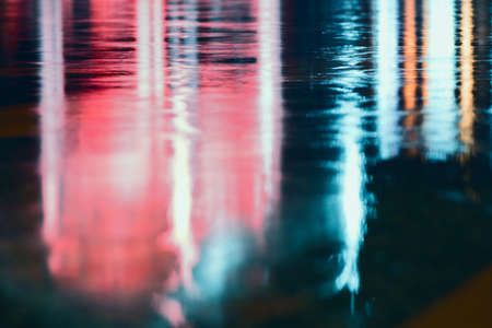 Light multicolored lights on the ground in raining day