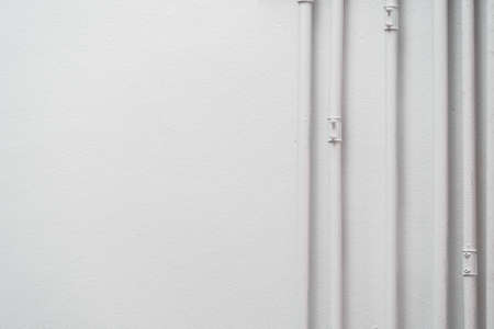 A pipe across the white walls in soft lightの写真素材