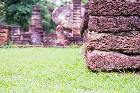 Laterite on the green grass in sun shine